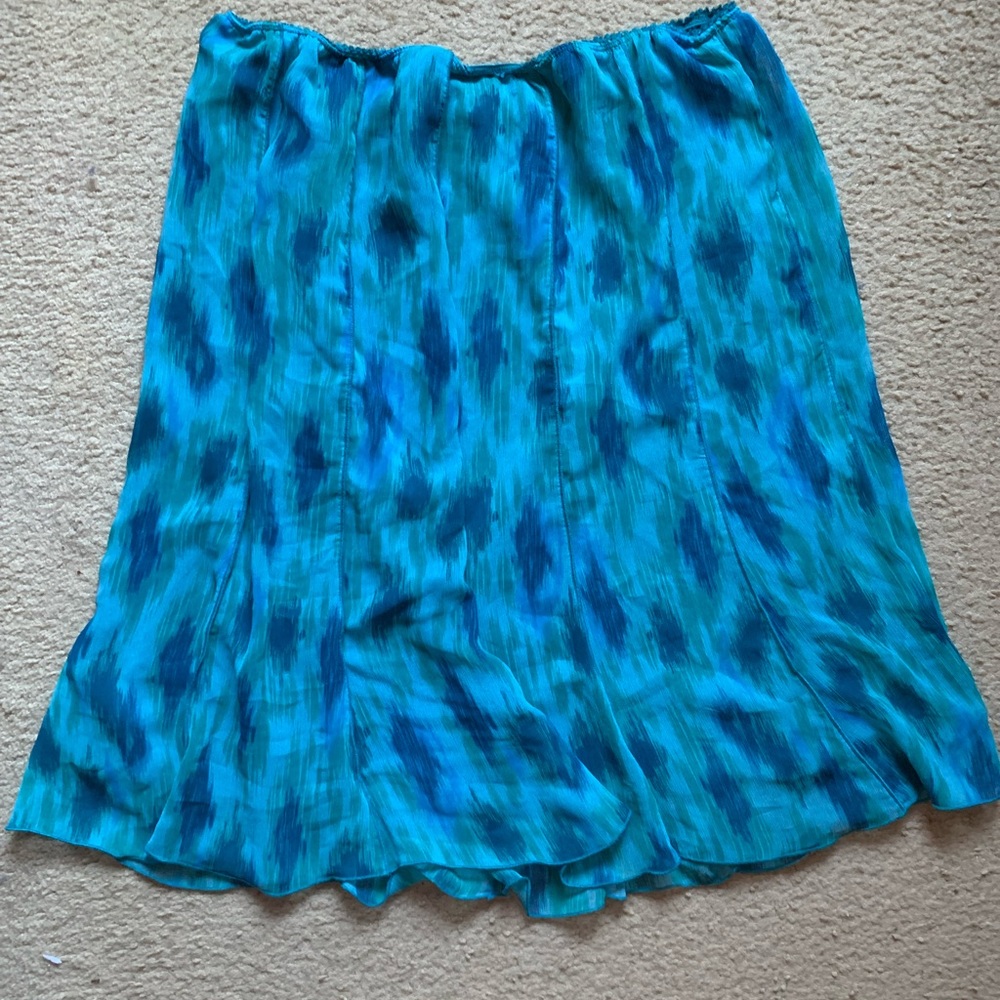 Knee length (depending on height) pleated skirt.